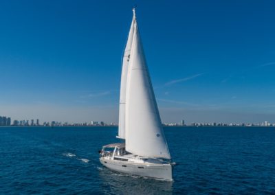 Yacht sailing on open sea at sunny day